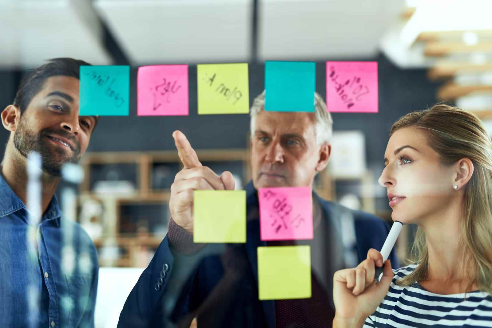 Image of people engaged in a discussion, symbolizing collaborative problem-solving. Text overlay features '411 Immigration Law' and 'Temporary Solutions for Specific Circumstances,' emphasizing tailored immigration assistance for unique situations.