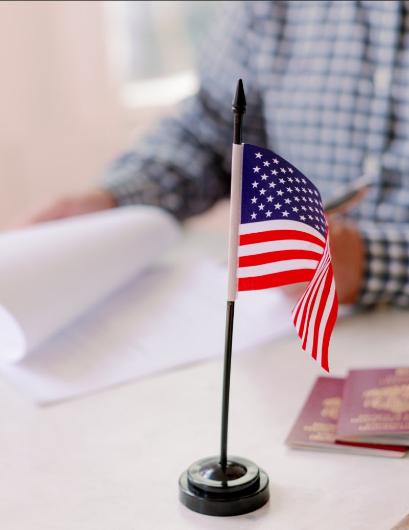 Lawyer providing counsel, featuring 411 Immigration Law and highlighting 'Navigating Complex Immigration Laws' to emphasize expert legal assistance.